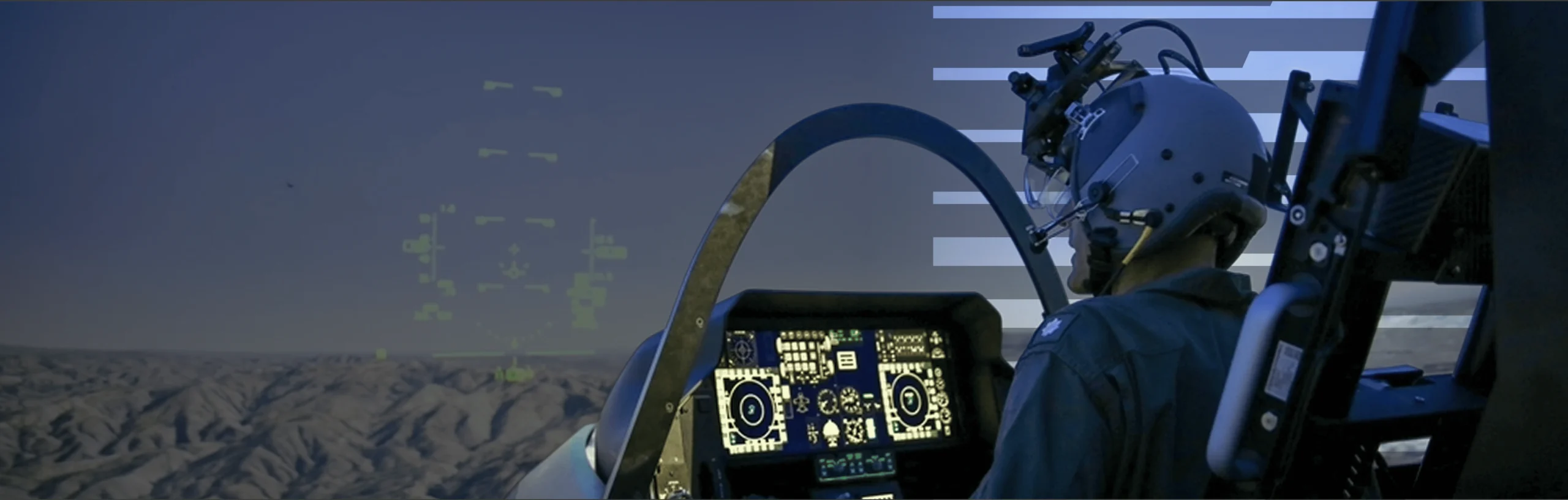 Pilot in cockpit with head-up display and tactical screens.