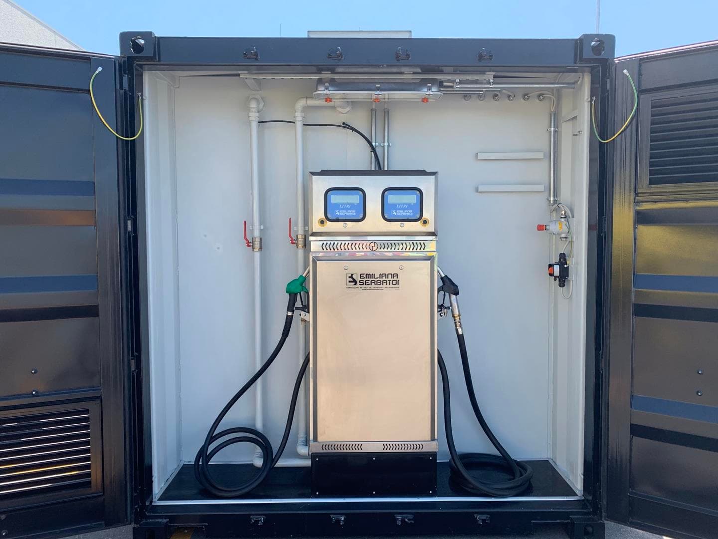 Containerized dual-nozzle fuel dispensing station featuring a stainless steel cabinet with digital displays.